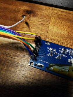 Close-up of a circuit board with connected colorful wires.