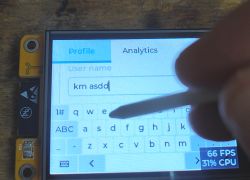 Entering Text on ESP32-2432S028R Touchscreen Person using a stylus to enter text on the ESP32-2432S028R touchscreen.