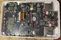 Interior of R36S handheld console showing the exposed motherboard and electronic components