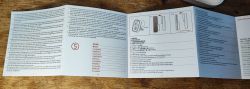 Sonoff SNZB-02D User Manual Sonoff SNZB-02D user manual spread out on a wooden surface.