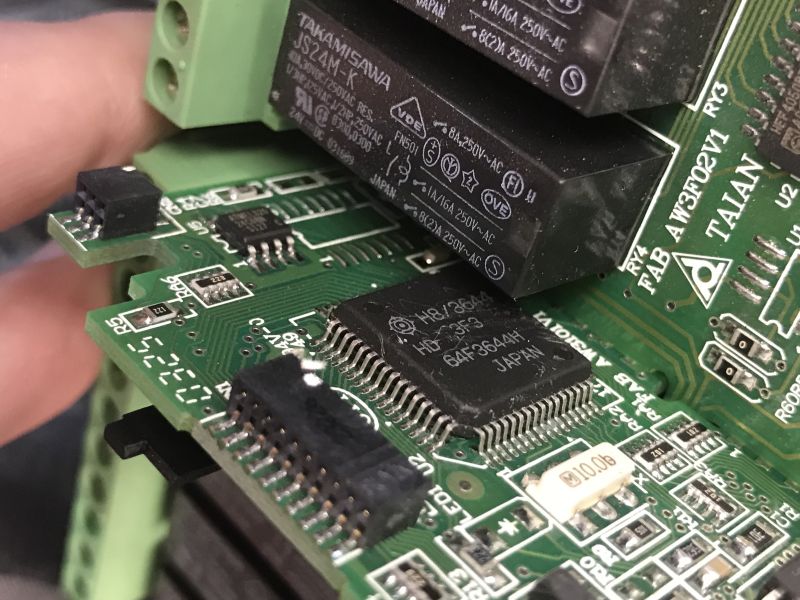 The interior of an old Schneider Electric SR1 A201BD programmable logic controller