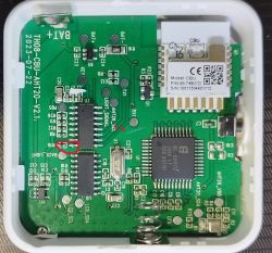 Close-up of a circuit board with markings and TX and RX signal wires.