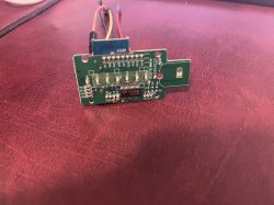 Close-up of a WB3S circuit board with visible electronic components and connected wires.
