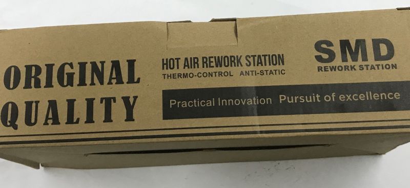 Brown cardboard box with text “ORIGINAL QUALITY” and “SMD HOT AIR REWORK STATION”