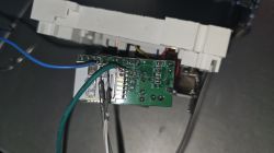 Close-up of an opened EARU 63A EAWCPT-J module with a visible 7231N chip and attached wires.