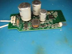 Electronic module with power and control components Close-up of circuit board with capacitors, inductor, and integrated circuits