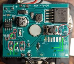 Close-up of a PCB with components, red circles, and green labels D0–D3