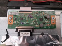 Television circuit board with visible electronic components.