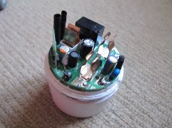 Inside of Disassembled Sonoff S60TPG UK Smart Plug Disassembled Sonoff S60TPG UK smart plug with exposed PCB and electronic components.