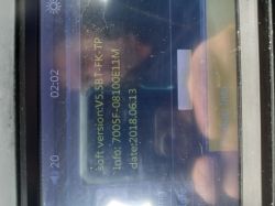 Car radio screen displaying software version and system details