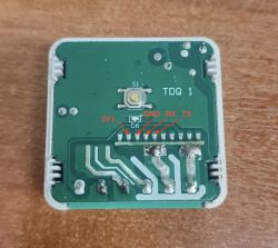 Circuit board with UART pin labels and central push button Electronic module with button and labeled UART pins: 3V3, GND, RX, TX
