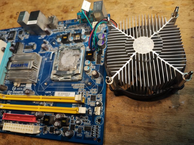 Old Motherboard with Heatsink Photo of an old GA-945GCM-S2L motherboard with a mounted heatsink.