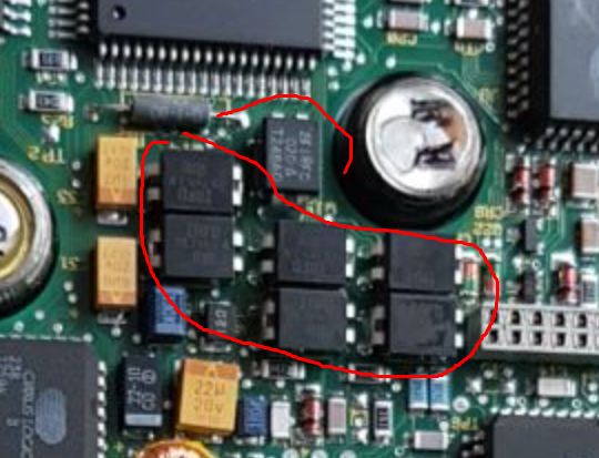 Close-up of an electronic circuit in a hard disk with components marked with a red line.