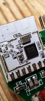 Close-up of a CB2L module with a BK7231N chip on a circuit board.