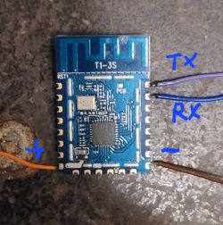 T1-3S communication module with wires labeled Tx, Rx, + and -