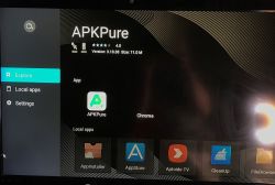 Menu aplikacji w Smart TV Box z APKPure na ekranie.