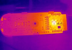 Thermal image showing an electronic board with a marked temperature of 36.7°C.