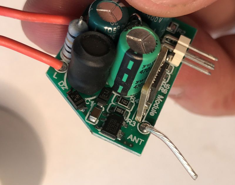 LED Bulb Control Board with WiFi Module and Power Supply Circuit Close-up of the LED bulb control board with WiFi module, antenna, and power components.