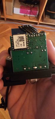 Electronic circuit board with a communication module in hand.