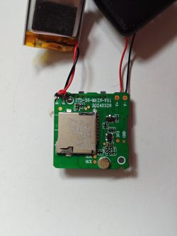 PCB with microSD Slot and Battery A printed circuit board with a microSD card slot and a connected battery.