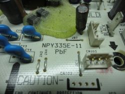 Close-up of a printed circuit board labeled NPY335E-11.