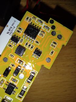 Close-up of a yellow PCB with visible electronic components, including an MD7620A integrated circuit.