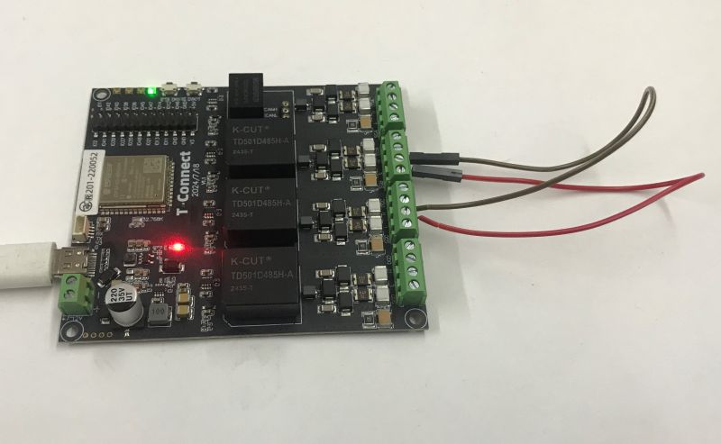 Lilygo T-Connect board with USB connected and screw terminals; green and red LEDs lit