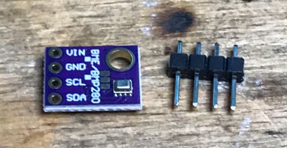 BME280 Module and Pin Set BME280 module with pins on a wooden surface