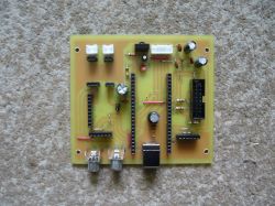 Assembled single-sided PCB with electronic components on a carpet