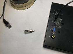 Close-up of BNC, RCA adapter and HDMI, VGA, AV ports on EM713 monitor