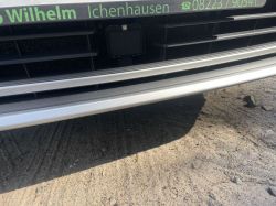 Lower part of a car bumper with the text Wilhelm Ichenhausen and a phone number.