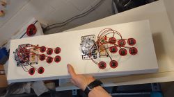 Game Machine Control Panel A hand holding a game machine control panel with installed buttons.