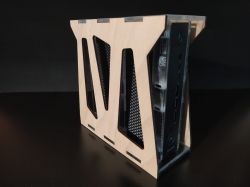 Wooden computer case with visible USB ports and power button on the front.