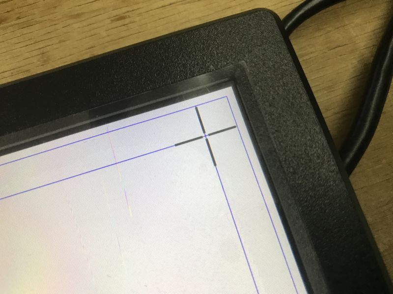 Close-up of a touchscreen monitor during touch calibration in Windows