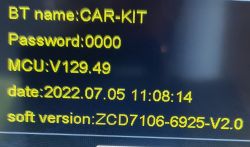 Close-up of a screen displaying Bluetooth CAR-KIT information, password, software versions, and date.