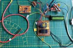 Electronic circuit with ESP8266, PT1000 sensor and LCD display on cutting mat
