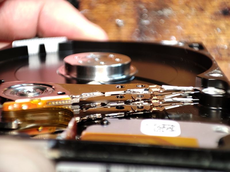 Hard Drive Interior with Visible Heads Interior of a hard drive showing the read/write heads' arms over the platters.