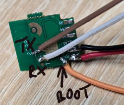 PCB module with TX, RX, and BOOT signal wires soldered to pads