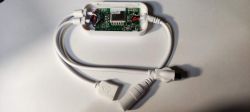 WX300P RGB Controller with Exposed Circuit Board WX300P RGB LED strip controller with open casing showing the circuit board with a soldered module.