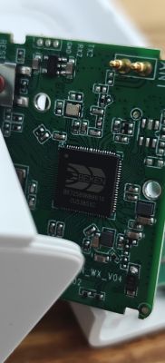 Close-up of a green PCB with a Beken BK7258 chip, SMD components, and labeled test pins.