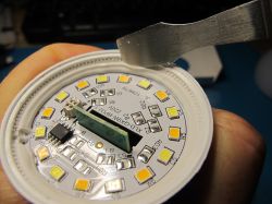 Interior of an LED lamp with control circuitry Close-up of LED lamp interior with circuit board and multiple LED elements