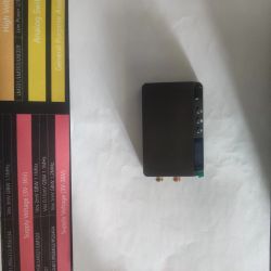 DP100 power supply on white background next to a colorful chart with IC parameters