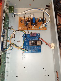 Inside a metal enclosure with several PCBs and wires, including a blue board labeled “INTERNET RADIO”.