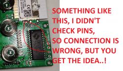 Photo of a circuit board with red text annotations suggesting example connections.