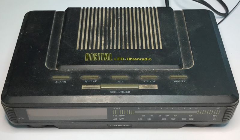 Digital Radio with LED Display Black digital radio with time display function and several control buttons.