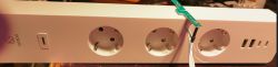 Woox R6132 Power Strip Close-up of Woox R6132 power strip with three sockets and USB ports.
