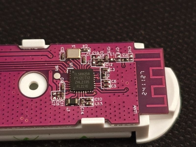 Close-up of Zigbee sensor PCB with TLSR8258 microcontroller