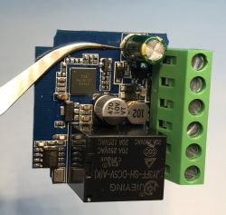 Circuit board with relay and screw terminal connector Electronic module with relay, capacitors, and screw terminal block
