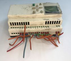The interior of an old Schneider Electric SR1 A201BD programmable logic controller