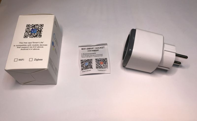 WiFi Smart Plug and Its Packaging WiFi smart plug with user manual and packaging.